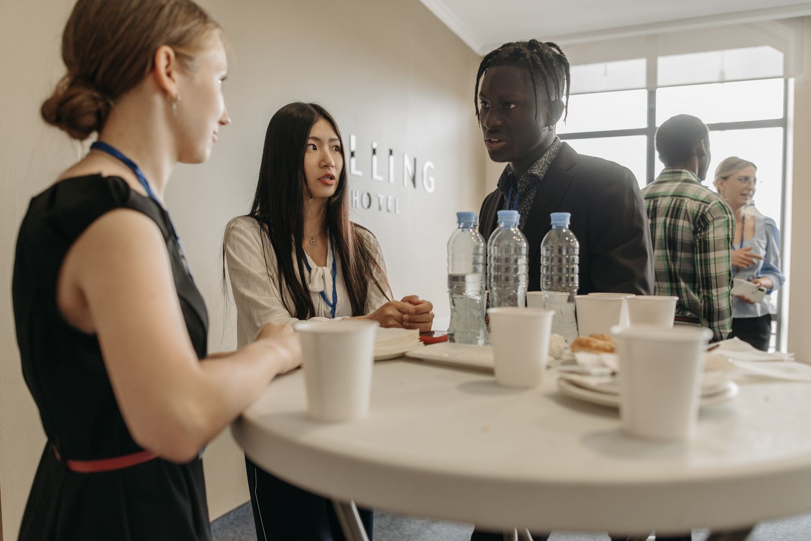 Business leaders networking at a LET Global conference