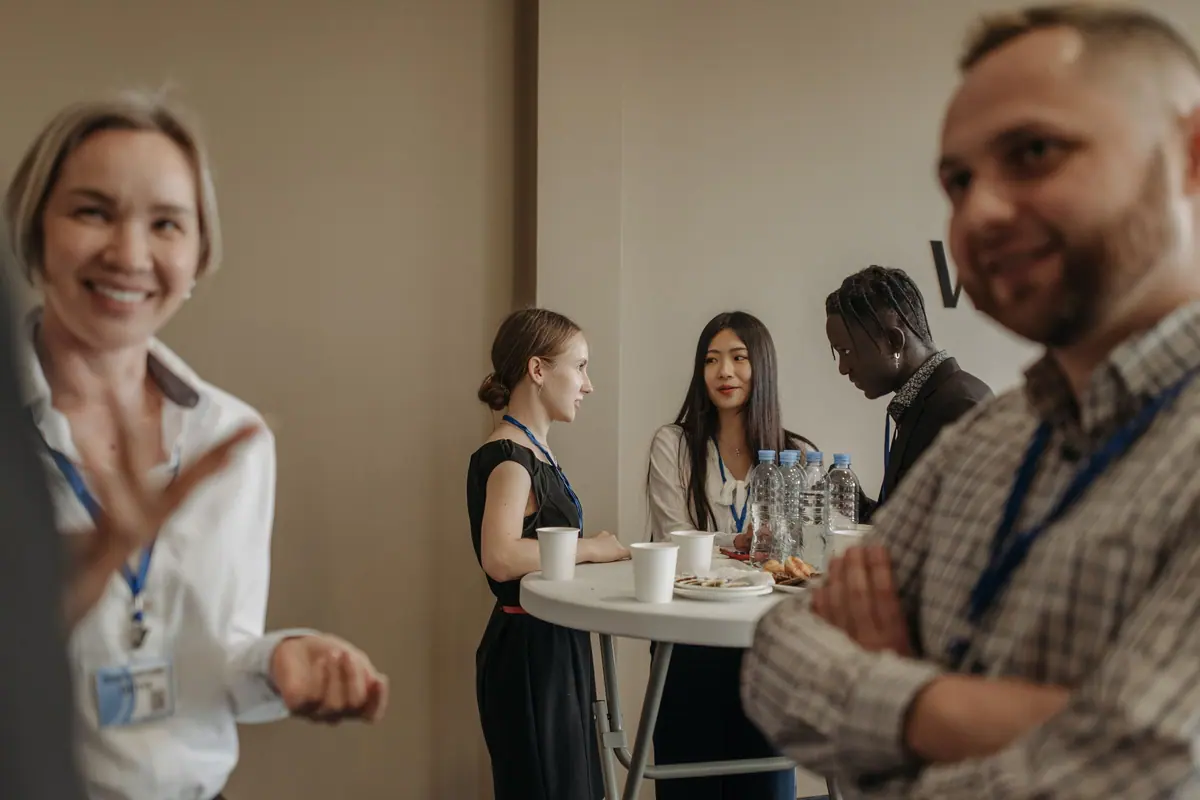 International delegates networking between leadership summit sessions