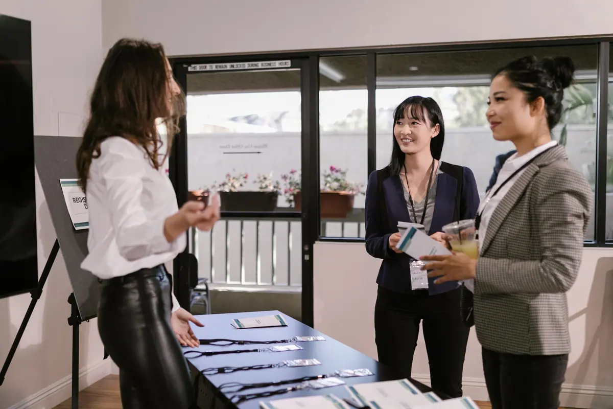 Women leaders connecting at the summit registration area